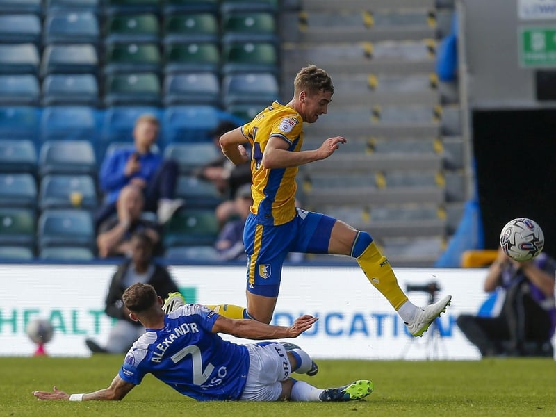 Loanee defender Louis Brunt skips over this challenge at Gillingham in September.