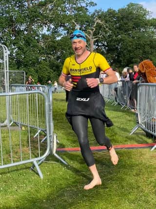 Daniel Wilson in transition between swim and run at Holkham
