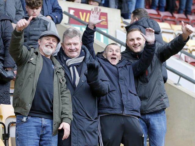 Travelling Stags fans watch the Sky Bet League 2 match against Bradford City.