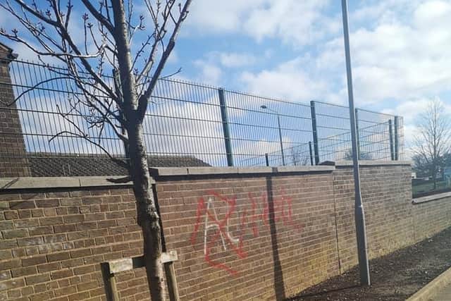 Graffiti on the side of Morrisons