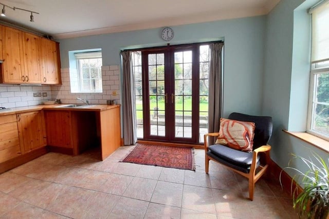 The breakfast kitchen includes these large doors, which open out into the delightful garden.