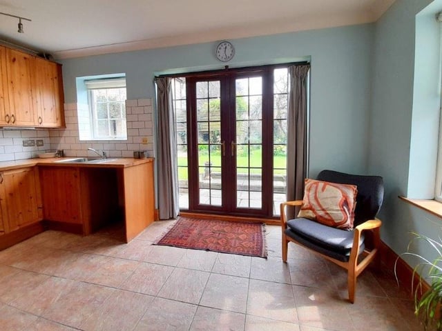 The breakfast kitchen includes these large doors, which open out into the delightful garden.