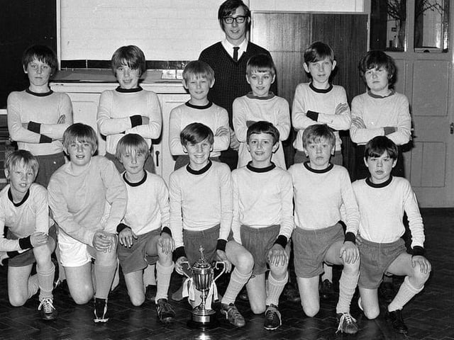 The school football team is pictured in 1971. The school closed in 2001 and became Asquith Primary School.