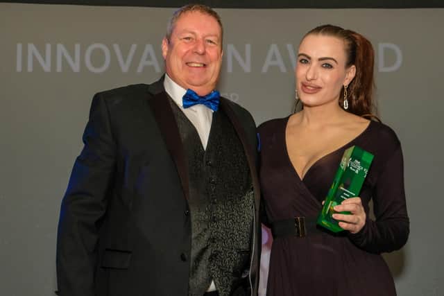Faye Finaro, of SOS Beauty, receives her innovation award from Mick Shaw, Plastek UK vice-president, at the 2022 Chad business excellence awards.