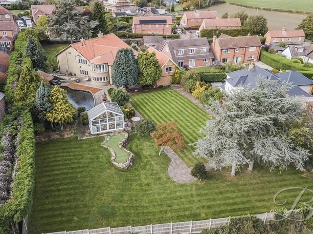 The expansive gardens are a particular highlight, featuring beautifully manicured lawns