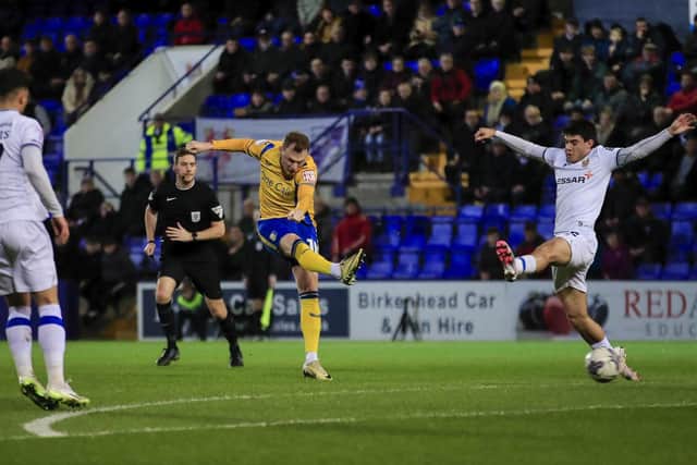 George Maris shoots during the Sky Bet League 2 match against Tranmere Rovers FC at Prenton Park, 12 March 2024Photo credit : Chris & Jeanette Holloway / The Bigger Picture.media