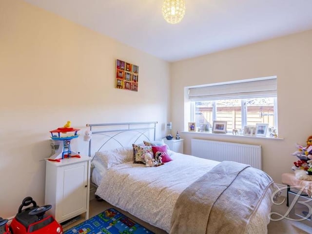 All three bedrooms have been decorated in a neutral colour palette, allowing you to design them how you wish. This is the third bedroom, which is currently being used as a child's room.