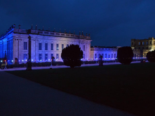 The house and walkways have been lit up.