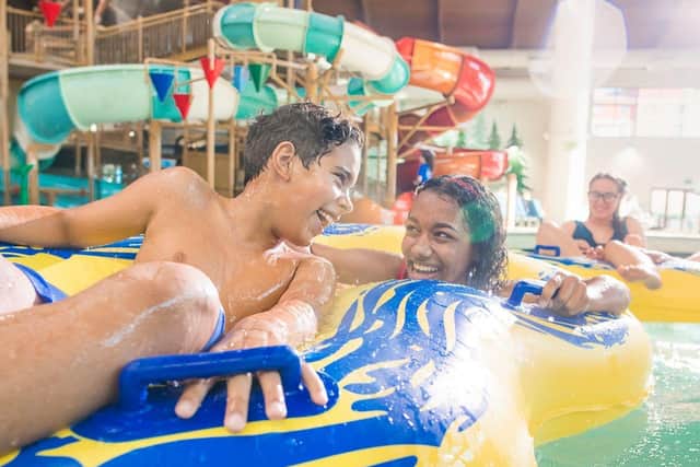 People enjoying the indoor water park at a Great Wolf Resort