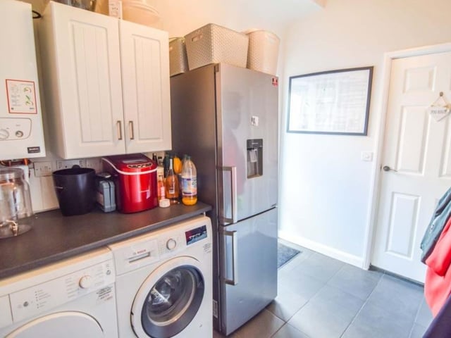 Next to the kitchen diner is this utility room. There is plenty of space for a fridge freezer, washing machine and tumble dryer.