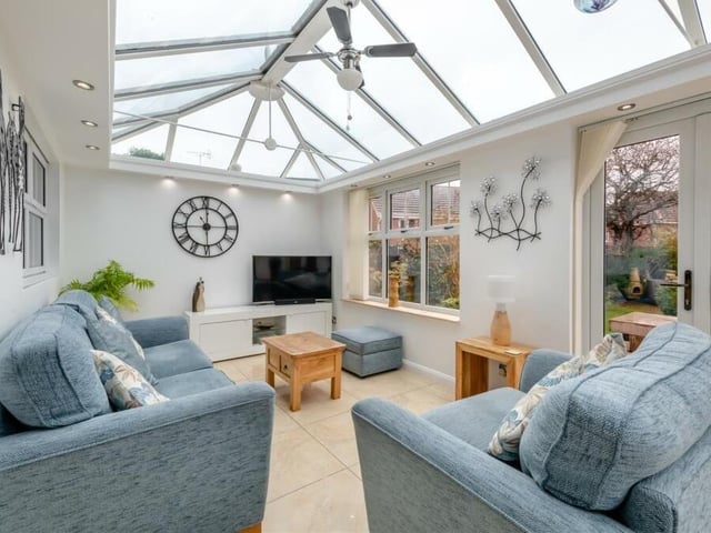 Double-glazed windows in the conservatory offer wonderful views of the rear garden, which can be accessed via French doors. Another door leads to a side patio.