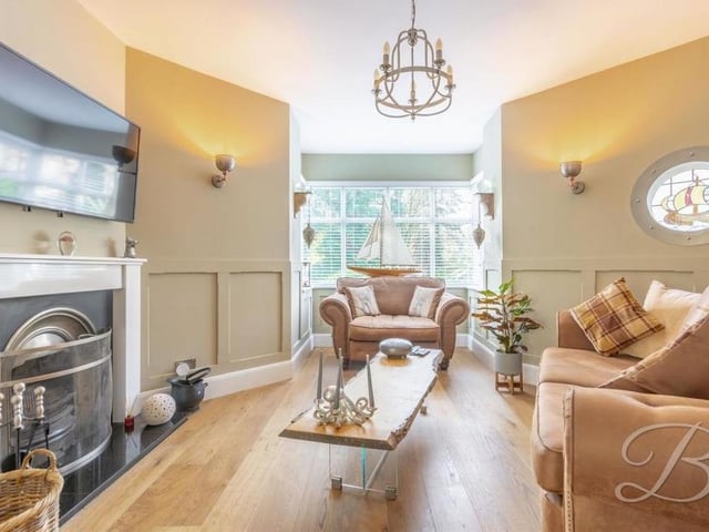 There is no better place to start our tour of the Lindhurst Lane house than the snug, one of two impressive reception rooms. Its oak floor, decorative panelling and open fire with suround help to create a warm and cosy space.