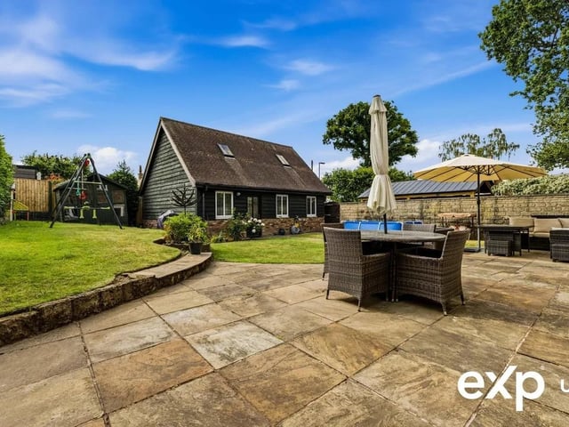 A beautiful paved patio stretches directly across the rear and extends the living space, offering ample room for garden furniture. It's just the spot for outdoor entertaining.