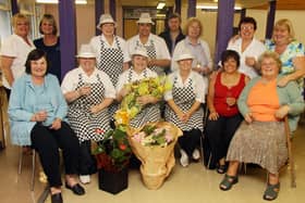 2010: Staff present gifts to Carol Norman (centre), who retired after 24 years at Kimberley School.