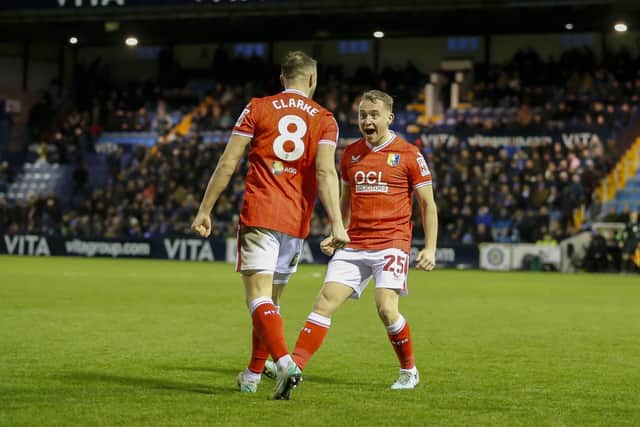 Ollie Clarke celebrates with Louis Reed at Stockport
Photo: Chris & Jeanette Holloway / The Bigger Picture.media