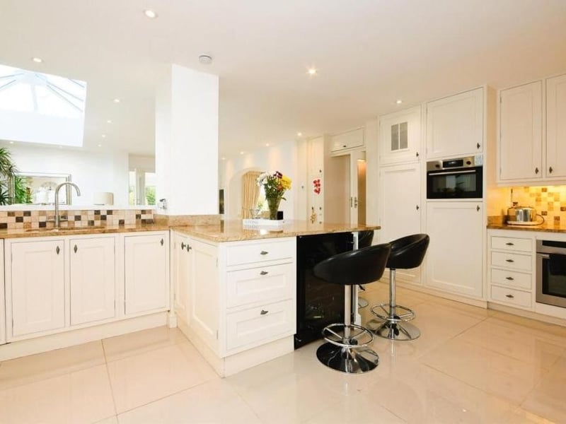 A final shot of the kitchen, which really is a chef's paradise. It owes much of its brightness to recessed spotlights and a floor-to-ceiling, double-glazed window facing the front of the property.