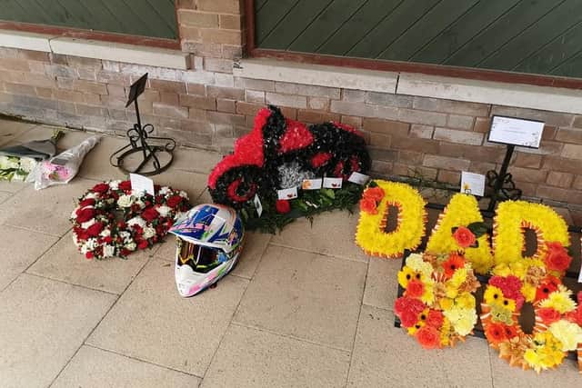 More of the flower tributes with one in the shape of a motorbike