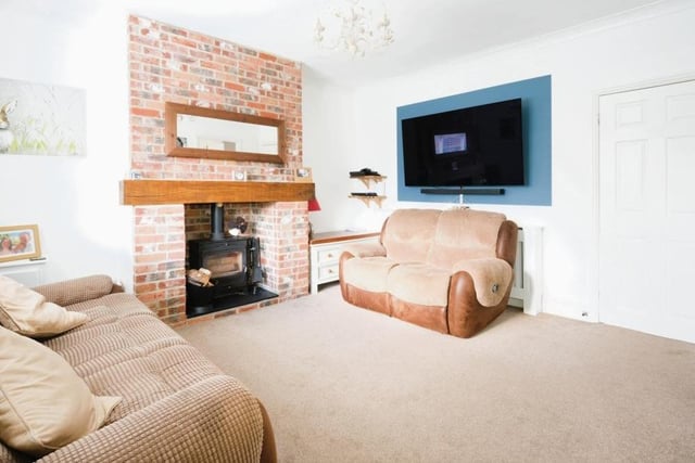 Let's begin our tour of the Selston house in the wonderfully warm and welcoming living room. Its main feature is a multi-fuel log-burner fireplace.