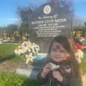 Beau Bolton visits her dad's grave in Harworth Cemetery.