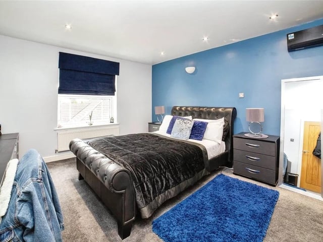 The property boasts ample bedrooms for a growing family.