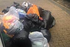 Sacks of donated clothes waiting to be stored in Emma's garage.