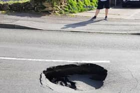 The picture of the sink hole taken this morning. It's believed to have significantly grown in size since the picture was taken.