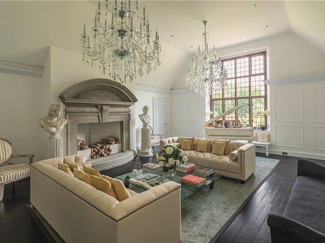 Chandeliers abound in this luxurious reception room at Hurst Lodge. The property has been modernised over the years, but it retains many of its period features, such as 17th century oak panelling and its original flooring and fireplaces.