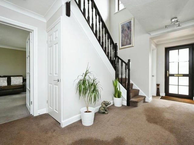 The warm and inviting atmosphere of the £500,000-plus Edwinstowe property is felt as soon as you step inside, to be greeted by this welcoming hallway.