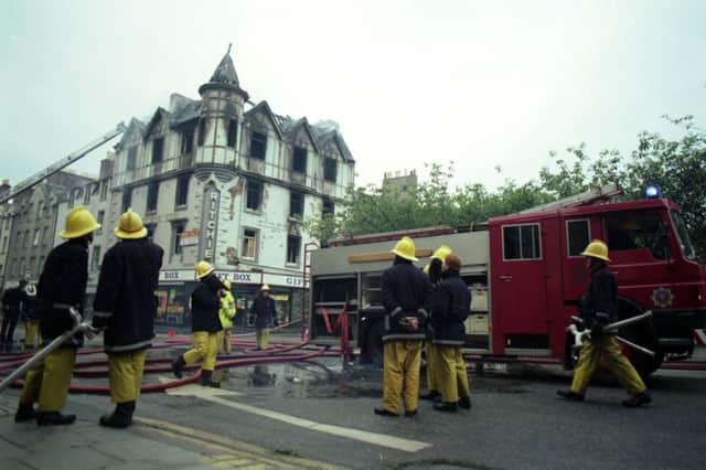The scene of a fire showing damage done to the Gift Box shop at the corner of Nicolson Square and Nicolson Street Edinburgh, June 1992.