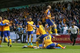 Stags celebrate play-off win at Northampton in May.
