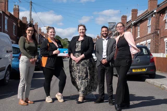 Police and Crime Commissioner Caroline Henry (centre) visited Tarina to present her with the camera which she won after taking part in a survey