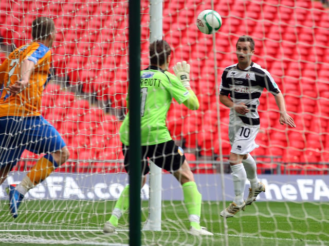 Depleted and out on their feet, Mansfield Town suffered the cruelest of defeats after they were beaten by Darlington 1-0 in the 2011 FA Trophy Final. The winning goal came in the last minute of extra-time.