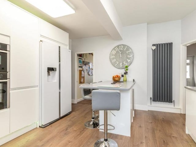 Integrated appliances in the kitchen/breakfast room include a Neff combi microwave and separate oven, four-ring induction hob, dishwasher and cooler. There is also space for a large American-style fridge/freezer, while under-cupboard mood lighting and a contemporary radiator add to the room's style.
