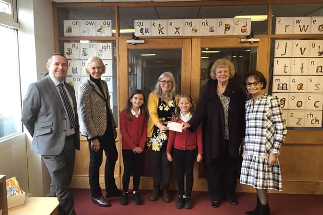 Head teacher James Marshall, trustee Jean Moulson, year four teacher Caroline Eady, trustee Vivienne Brown, chair of governors Christine Bacon and year four pupils Jess and Tianna.