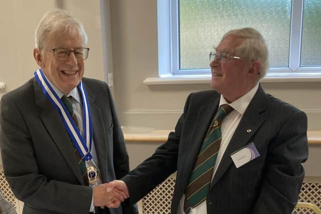 The new president of Mansfield Men's Probus Club, Michael Hawley, left, is congratulated by the outgoing president Arnold Bower