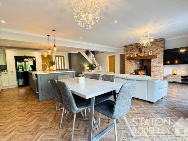 There is a multi fuel log burner with a built brick surround which is the lovely space to enjoy cozying up to on a winters evening.