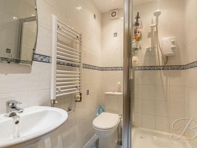 An added bonus on the ground floor of the £475,000 house is this shower room, which contains an enclosed shower cubicle, low-flush WC, wash hand basin, heated towel-rail and full-height tiling,.