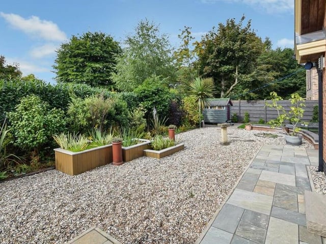 Another attractive corner of the garden, complete with plants and shrubs,