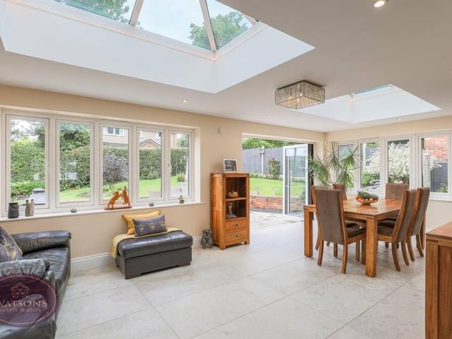 Beyond the lounge is this bright and opulent orangery, with doors leading out to the rear garden, and windows to the rear and side. A Fatra roof encompasses two sky lanterns.