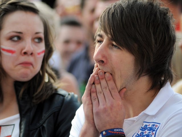 Glum-faced England fans at The Swan in Mansfield