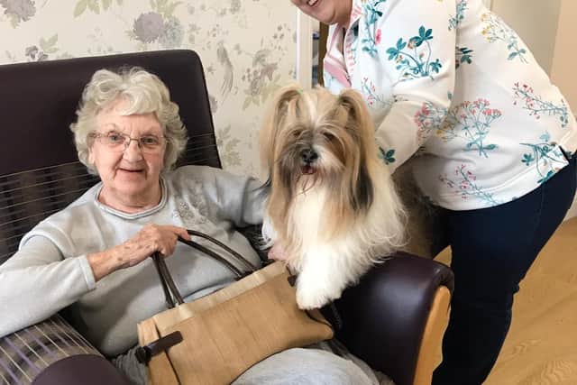 Red Oaks resident Hilda Hubbard with Marlo and his owner Janet Bennett