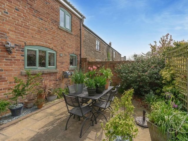 This quiet corner of the garden is a pleasant spot in which to relax or even entertain friends over a few drinks.