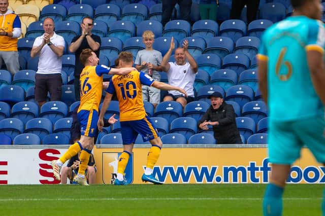 George Maris celebrates the opening goal against Newport County.