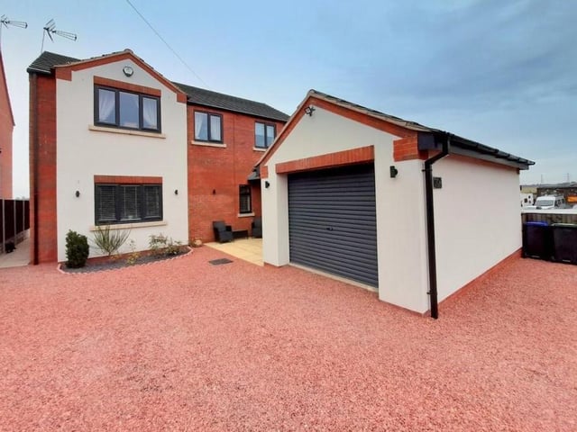 The Kirkby property comes with this impressive garage, which has power and light. Access is via a remote-controlled roller-door.