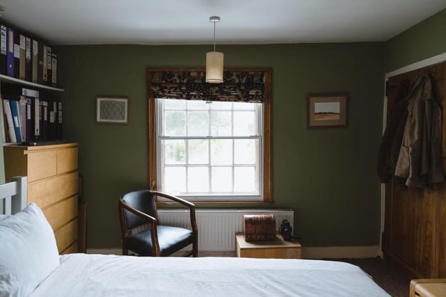 All three of the double bedrooms on the first floor of the main house have large sash windows. This photo also shows a large wardrobe in the master bedroom.