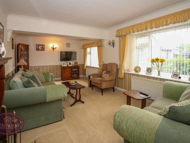 The warm and comfortable lounge from a different angle. It is bright too, thanks to two uPVC double-glazed windows facing the front of the property.
