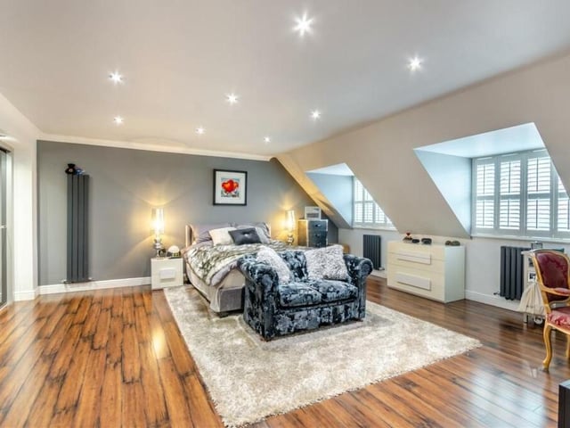 The master bedroom is a substantial suite overlooking the front of the Calladine Grove house. It features a hardwood-style laminate floor, 11 LED ceiling spotlights, three modern aluminium radiators and oodles of space. Not to mention fitted wardrobes and access to an en suite wet room.