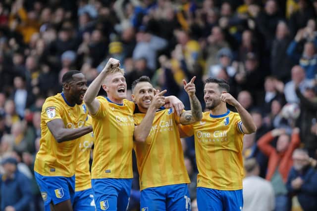 Will Evans celebrates with his team-mates after Lee Gregory scores against Birmingham City.