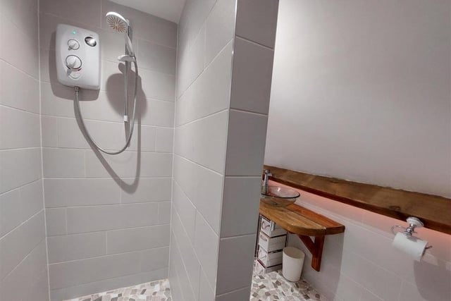 The master bedroom boasts its own en suite. It is newly installed, complete with this stylish shower cubicle.