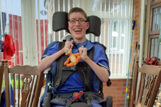 Kieron, now grown up but with that same Tigger toy he held in his incubator back in 2000.